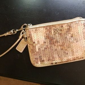 Gold sparkly coach wristlet